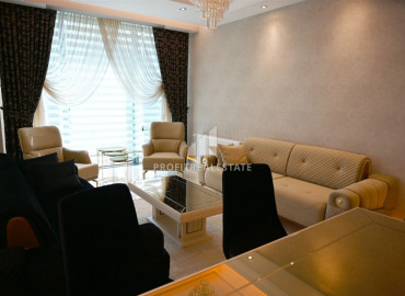 Elegant 2 + 1 apartment with designer interior in a new luxury residence in Mahmutlar ID-9630 фото-1