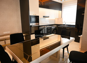 Elegant 2 + 1 apartment with designer interior in a new luxury residence in Mahmutlar ID-9630 фото-3