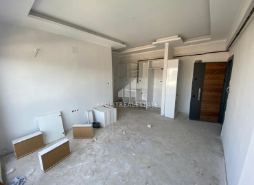 One-bedroom apartment, 40m², in a new residence 350 meters from the center of Tece, Mersin ID-9641 фото-3