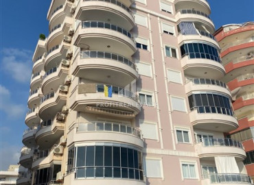 Large furnished 2 + 1 view apartment on the first coastline in Mahmutlar ID-9841 фото-1