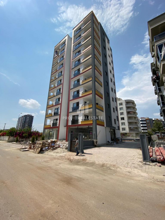 Two bedroom apartment in a new gasified residence with a swimming pool, by the sea in Tece, Mersin ID-10055 фото-1