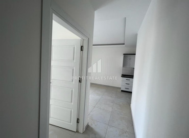 Новые апартаменты, с одной спальней, в чистовой отделке, в 300 метрах от центра Махмутлара, Аланья 55 м2 ID-10061 фото-2}}