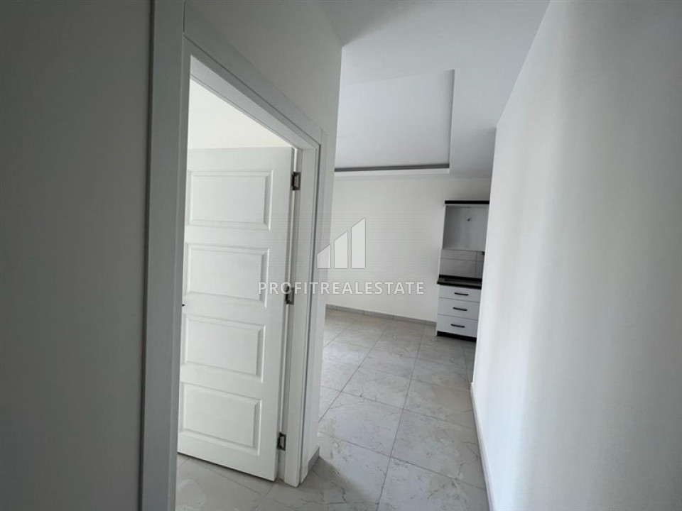 Новые апартаменты, с одной спальней, в чистовой отделке, в 300 метрах от центра Махмутлара, Аланья 55 м2 ID-10061 фото-2