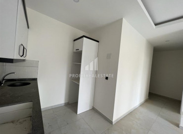 Новые апартаменты, с одной спальней, в чистовой отделке, в 300 метрах от центра Махмутлара, Аланья 55 м2 ID-10061 фото-7