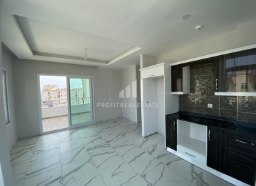 Two-bedroom apartment, 110m², on a high floor 150m from the sea in Tomuk area, Mersin ID-10075 фото-3}}
