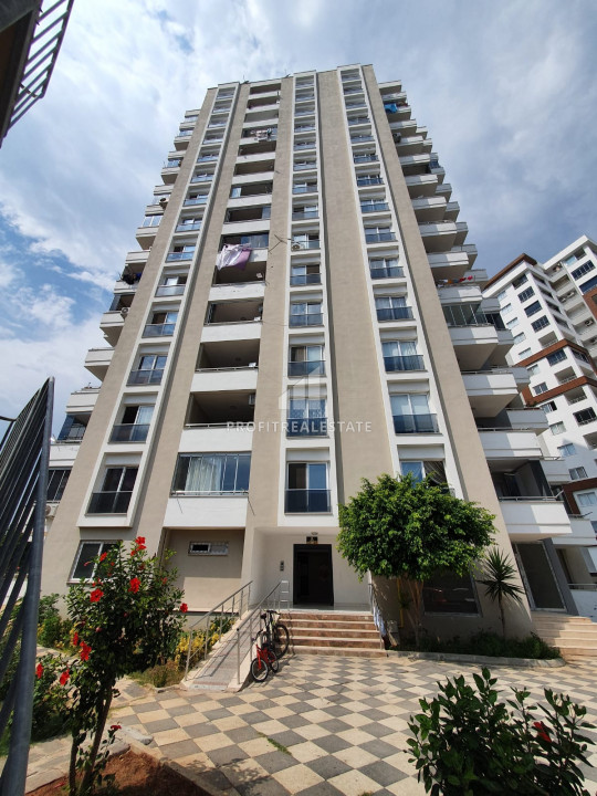Gasified furnished apartment 1 + 1 in a residence with facilities by the sea in Teсe, Mersin ID-10117 фото-1