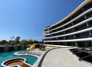 One bedroom apartment, 65m², in a new luxury beachfront complex in Kargicak, Alanya ID-10147 фото-1}}