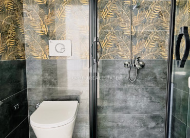 Two bedroom apartment, 90m², in a new residence with a swimming pool, with a good location in Mahmutlar ID-10313 фото-10