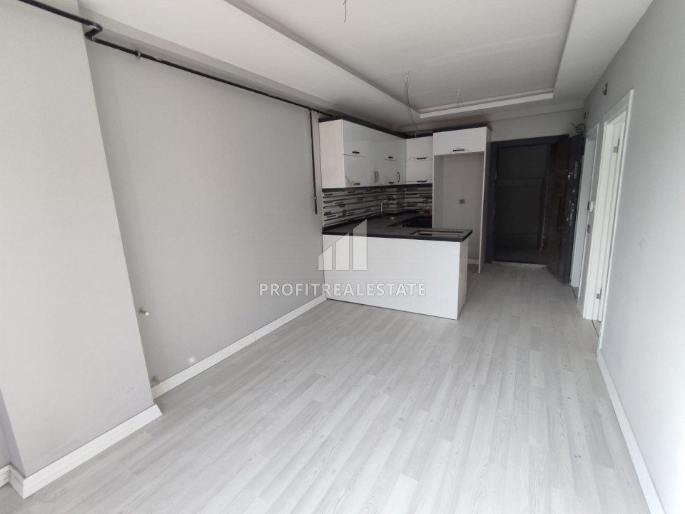 Новая квартира с одной спальней, 72м², в центре Мерсина, в районе Енишехир, 600м от моря ID-10572 фото-2