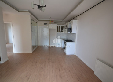 Новая квартира с двумя спальнями, 100м², без мебели, в 500м от моря в районе Мезитли, Мерсин ID-10628 фото-1