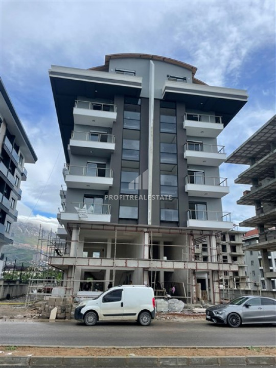Двухкомнатные апартаменты, 53м², на этапе строительства, в 150м от моря в районе Каргыджак ID-10895 фото-1