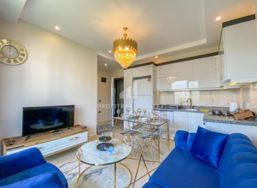 Stylish bright one-bedroom apartment 50 m2, ready to move in, with mountain views, in Mahmutlar, Alanya ID-11472 фото-2