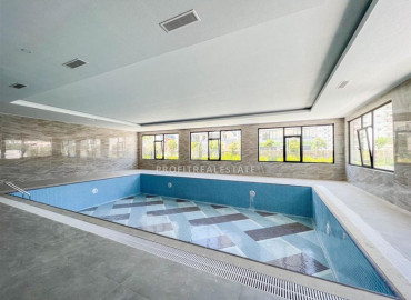 Stylish bright one-bedroom apartment 50 m2, ready to move in, with mountain views, in Mahmutlar, Alanya ID-11472 фото-8