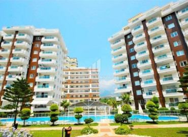 Двухкомнатная квартира, готовая к заселению, в ухоженном жилом комплексе с богатой инфраструктурой, Махмутлар, Аланья, 65 м2 ID-11542 фото-1