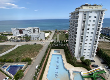 View apartment with two bedrooms, 115m², in a residence with a water park 100m from the sea in Teje, Mersin ID-11546 фото-1