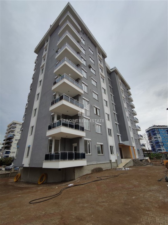 Элегантная двухкомнатная квартира 65 м2, в комплексе с инфраструктурой в Махмутларе, Аланья ID-11607 фото-1