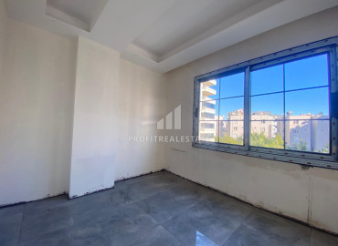 Новая двухкомнатная квартира, 50м², в доме городского типа в центре Мезитли, Мерсин ID-11793 фото-2