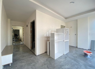 Новая двухкомнатная квартира, 50м², в доме городского типа в центре Мезитли, Мерсин ID-11793 фото-5