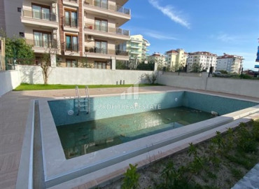 Компактная двухкомнатная квартира, 50м², в новой резиденции в 250м от моря в районе Кестель, Алания ID-12023 фото-2