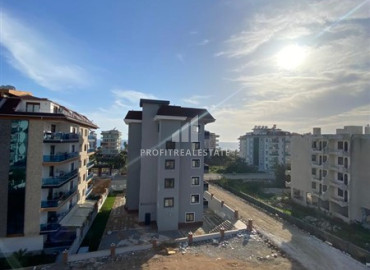 Компактная двухкомнатная квартира, 50м², в новой резиденции в 250м от моря в районе Кестель, Алания ID-12023 фото-11