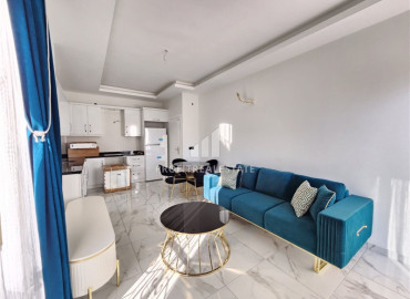 Меблированная двухкомнатная квартира с дизайнерским интерьером, в новостройке в Махмутларе, Аланья ID-12045 фото-5