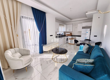 Меблированная двухкомнатная квартира с дизайнерским интерьером, в новостройке в Махмутларе, Аланья ID-12045 фото-9