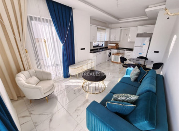 Меблированная двухкомнатная квартира с дизайнерским интерьером, в новостройке в Махмутларе, Аланья ID-12045 фото-10
