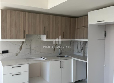 One-bedroom apartment in a new building, 350 meters from the sea, with a fine finish, unfurnished, in the center of Alanya ID-12064 фото-18