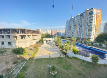 Апартаменты 1+1, 60м², в комплексе с бассейном на этапе строительства в районе Томюк, Мерсин ID-12133 фото-9