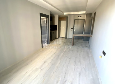 Стильная квартира с одной спальней, 55м², в новом комплексе с бассейном в районе Томюк, Мерсин ID-12146 фото-3