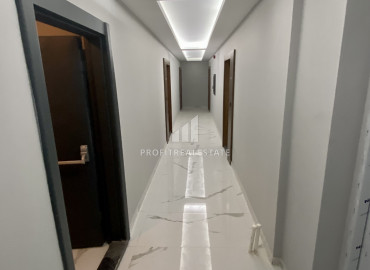 Стильная квартира с одной спальней, 55м², в новом комплексе с бассейном в районе Томюк, Мерсин ID-12146 фото-15