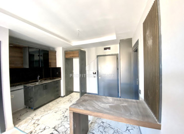 Ergonomic one-bedroom apartment, 55m², on a high floor in a new residence in the Tomyuk area, Mersin ID-12157 фото-1