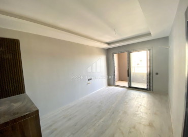 Эргономичная двухкомнатная квартира, 55м², на высоком этаже в новом комплексе в районе Томюк, Мерсин ID-12157 фото-4