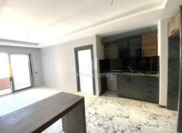 Ergonomic one-bedroom apartment, 55m², on a high floor in a new residence in the Tomyuk area, Mersin ID-12157 фото-5