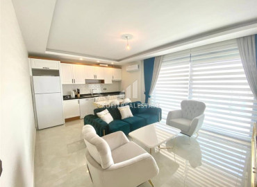 Elegant two bedroom apartment 90m2 on the first line, with panoramic sea views in Mahmutlar, Alanya ID-12158 фото-2