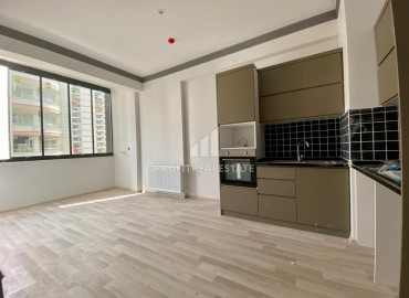 Новая двухкомнатная квартира, 55м², с чистовой отделкой в газифицированном комплексе, в центре Мезитли, Мерсин ID-12307 фото-2