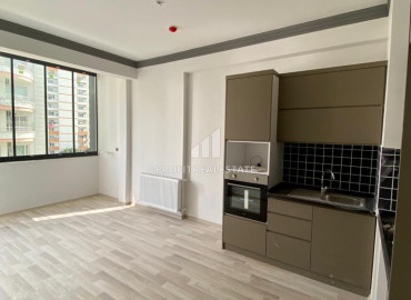 Новая двухкомнатная квартира, 55м², с чистовой отделкой в газифицированном комплексе, в центре Мезитли, Мерсин ID-12307 фото-4