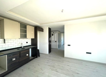 Новая квартира с двумя спальнями, 100м², в малоквартирном газифицированном комплексе в Енишехир, Мерсин ID-12323 фото-4