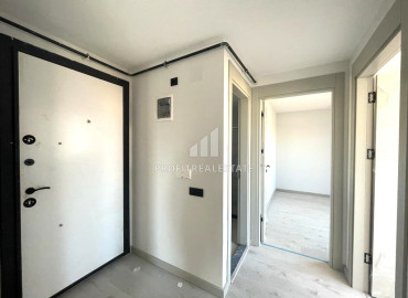Новая квартира с двумя спальнями, 100м², в малоквартирном газифицированном комплексе в Енишехир, Мерсин ID-12323 фото-8