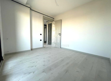 Новая квартира с двумя спальнями, 100м², в малоквартирном газифицированном комплексе в Енишехир, Мерсин ID-12323 фото-11