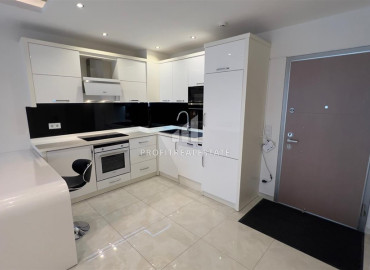 Меблированная квартира 1+1, на первой береговой линии, с застекленным балконом и теплыми полами, в центре  Махмутлара, Аланья ID-12391 фото-5