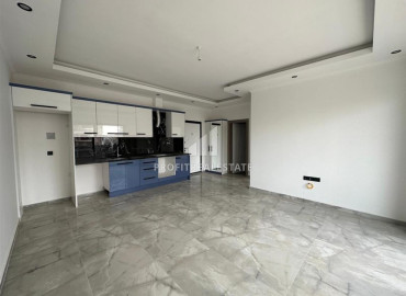 Fresh apartment in a new building with a fine finish without furniture in Mahmutlar, Alanya ID-10623 фото-2