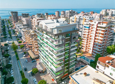 Стильные трёхкомнатные апартаменты 125 м2, с застеклённым балконом, в 300 метрах от моря в Махмутларе, Аланья ID-12742 фото-1