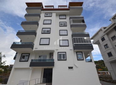 Бюджетная двухкомнатная квартира, 52м², в доме городского типа в 1750м от моря в районе Газипаша, Алания ID-12767 фото-1