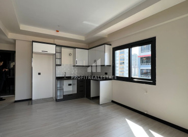 Апартаменты с одной спальней, 55м², в новом доме в 550м от моря, в центре Тедже, Мерсин ID-12784 фото-2