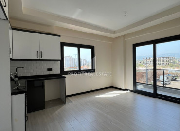 One-bedroom apartment, 55m², in a new building 550m from the sea, in the center of Teje, Mersin ID-12784 фото-3