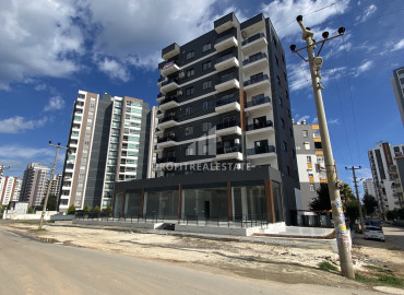 One-bedroom apartment, 55m², in a new building 550m from the sea, in the center of Teje, Mersin ID-12784 фото-11