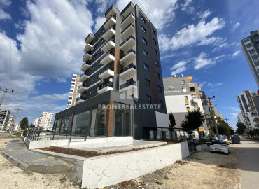 One-bedroom apartment, 55m², in a new building 550m from the sea, in the center of Teje, Mersin ID-12784 фото-12