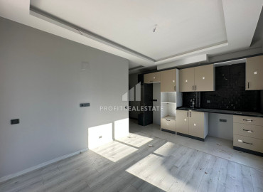 One-bedroom apartment, 50m², in a new small apartment residence in the Tomyuk area, Mersin ID-12786 фото-4