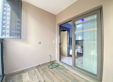 Компактная квартира 1+1, 55м² в новом газифицированном доме городского типа, в 500м от моря в Тедже, Мерсин ID-12790 фото-8
